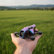 A compact, colorful RC quadcopter labeled 