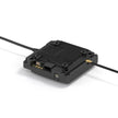 The HeadphoneHeat WalkSnail Avatar Pro Night Vision Edition HD is a compact black module with a ribbed rectangular casing for FPV goggles, 1080P 120fps support, and two cables—one USB and one gold connector—resting on a white surface.