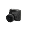 A compact black camera module with a large lens and “HeadphoneHeat” branding is shown at an angle on a white background. The WalkSnail Avatar Pro Night Vision Edition HD offers 1080P 120fps for crystal-clear FPV goggle footage.