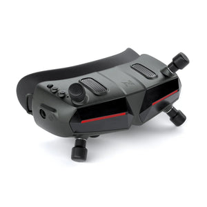 The HeadphoneHeat WalkSnail Avatar Pro Night Vision Edition HD are black FPV goggles with dual front cameras, buttons, two antennas, and 1080P 120fps support for immersive experiences or remote drone piloting.